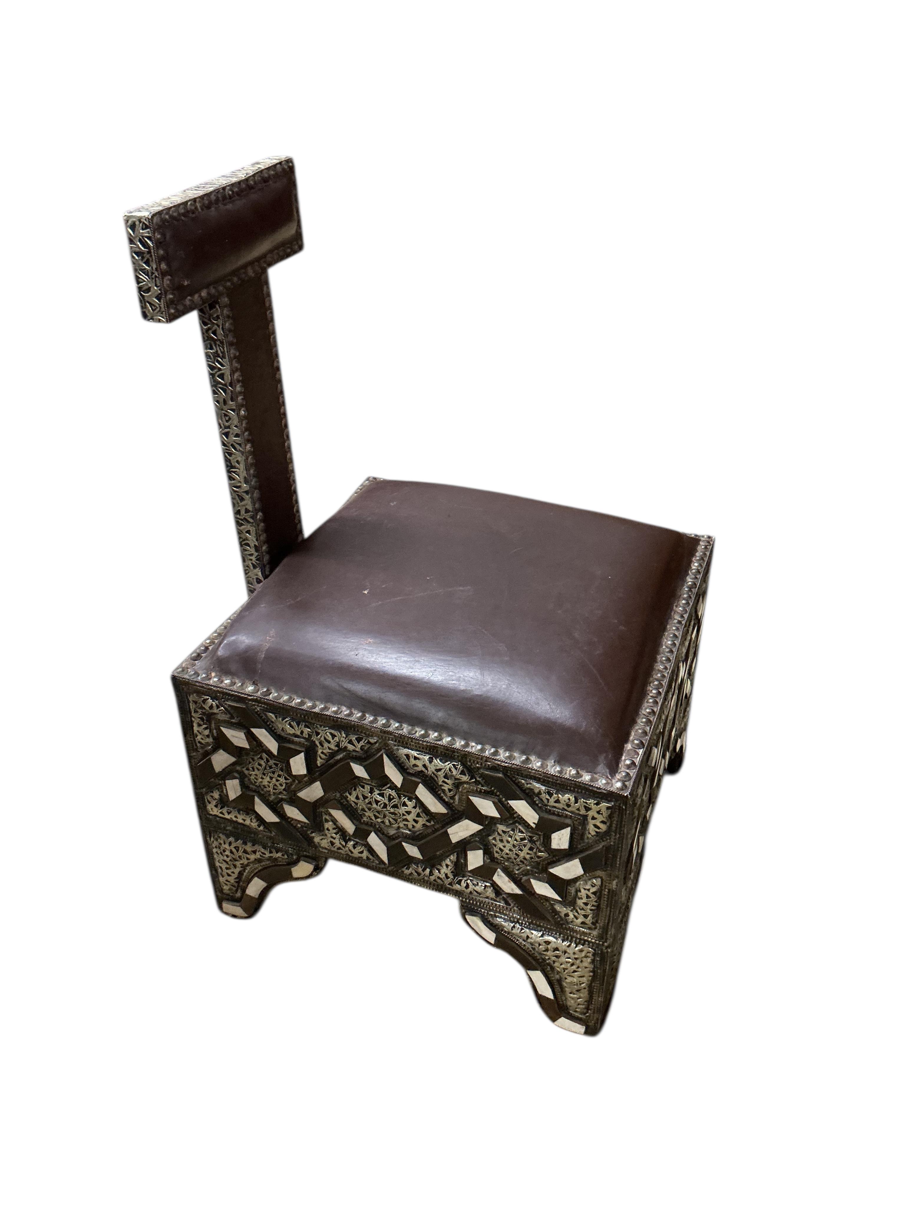 A pair of 20th century Moroccan Berber bone, horn and repousse metal chairs with seats, width 45cm, depth 45cm, height 75cm